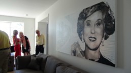 At the grand opening of the restored villa in Cannes, guests admire the Estee Lauder portrait painting