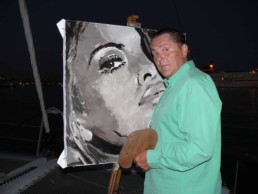 Peter Engels performing the finishing touches on the Eva Mendes portrait painting in the port of Palma de Mallorca
