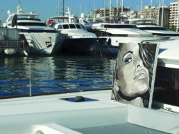 The Eva Mendes portrait painting by Peter Engels in the port of Palma de Mallorca onboard of the catamaran on which he created the canvas.