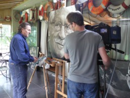 The filming of the final stage of the Bob Mendes portrait painting by Peter Engels