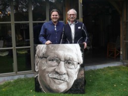 Thriller writer Bob Mendes and portrait painter Peter Engels with the painting