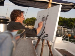 Aboard his yacht Peter Engels is working on the Dalai Lama portrait painting