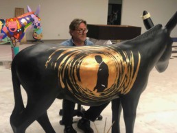 Artist Peter Engels working on the James Bond art donkey. Donkey Parade