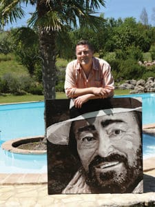 Peter Engels with the Luciano Pavarotti portrait painting at the house in Tuscany