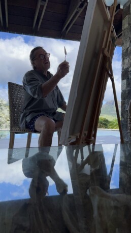 Artist Peter Engels working on Brigitte Bardot playing guitar in windy Mauritius